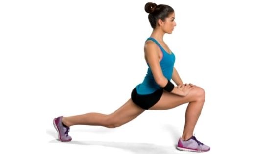 Woman doing lunges in a leg workout for beginners